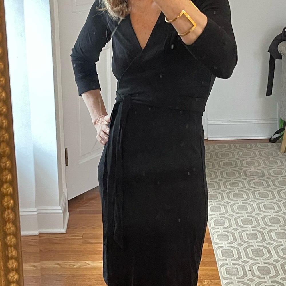 Like new Diane Von Furstenburg chic mid length Black Wrap Dress